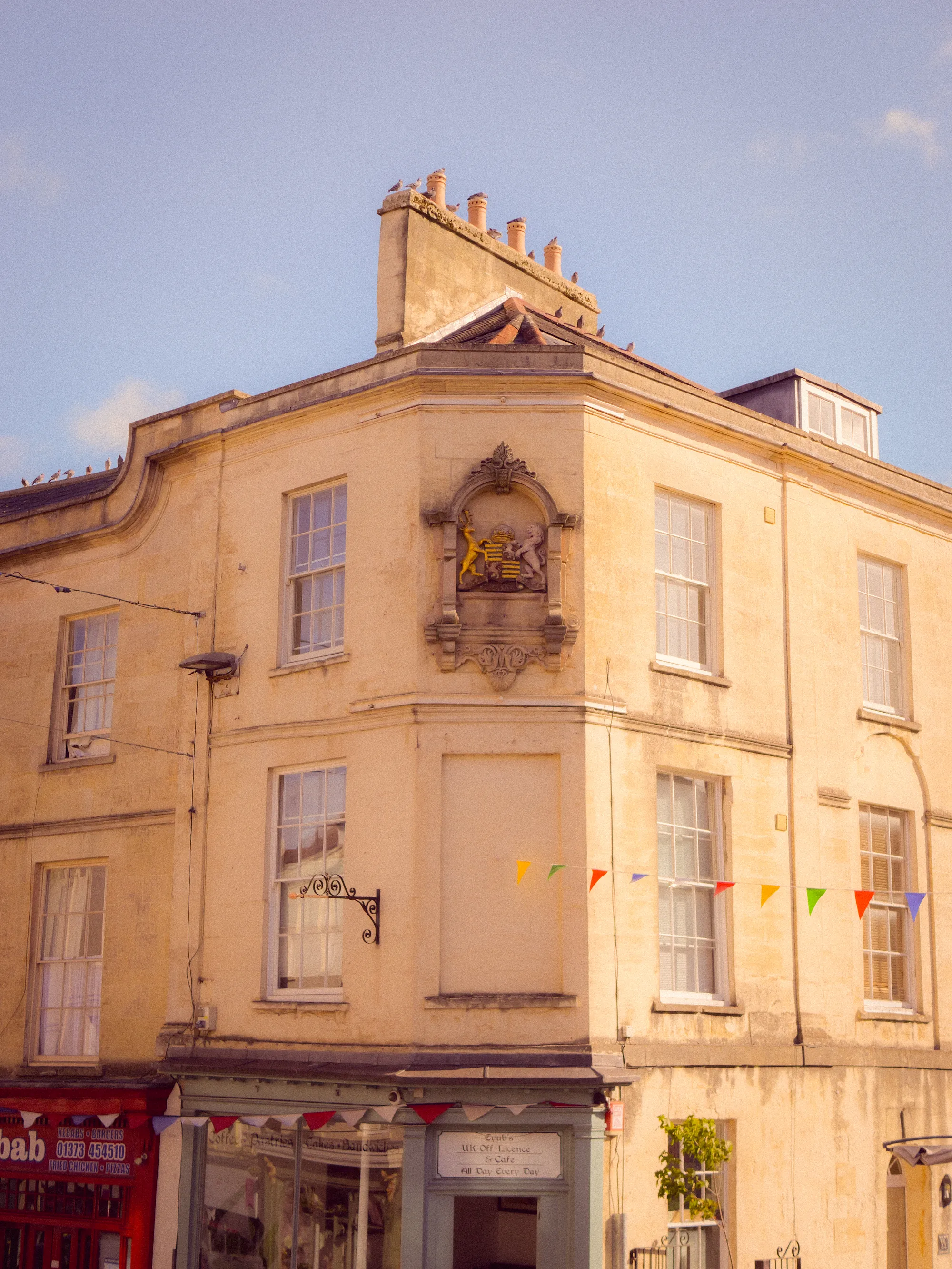 A corner townhouse in warm evening light